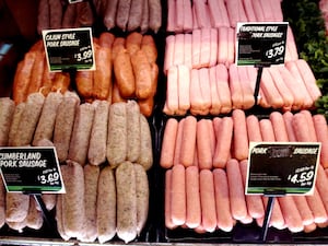 Sausages on display in a supermarket