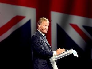 Reform UK MP Rupert Lowe speaking at the party's conference