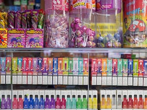 Disposable vapes of varying flavours on sale in a store