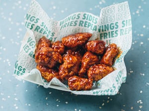 Chicken chain Wingstop is being targeted by suitors including Domino's for a takeover deal (Deliveroo/PA)