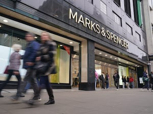 Exterior view of an M&S shop, with shoppers outside