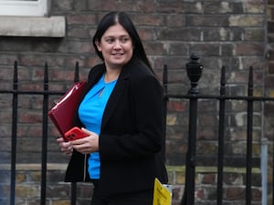 Lisa Nandy, carrying a red folder and red phone, leaves a Cabinet meeting