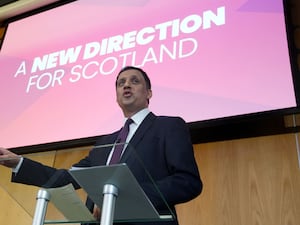 Anas Sarwar gesturing as he makes a speech