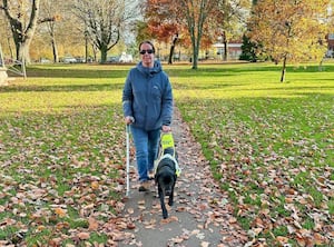 Yukiko guiding her owner Zena. 