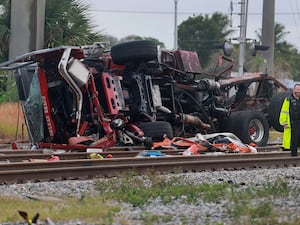 A destroyed fire truck lying on its side