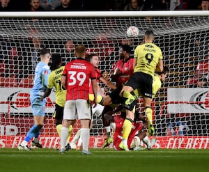 Gassan Ahadme heads in the third goal for Charlton.