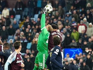 Aston Villa’s Diego Carlos battles for the ball with Juventus goalkeeper Michele Di Gregorio