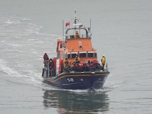 A group of people thought to be migrants are brought in to Dover by the RNLI