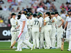 England’s Sophie Ecclestone, front left, walks off after losing her wicket