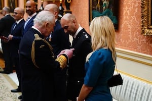 The King Charles presents the Humanitarian edal to Shyam Rana at Buckingham Palace.