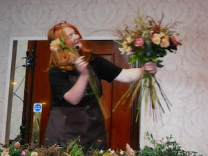 Pam Moseley, Quirky Flowers hand-tying a bouquet