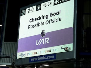 A big screen showing a VAR check