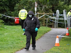 A police officer at the scene in Franklin Park, Leicester, where pensioner Bhim Kohli was attacked