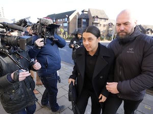 Sam Kerr arrives at court with a bodyguard