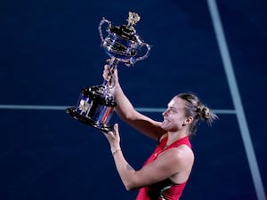 Aryna Sabalenka holds up the Australian Open trophy