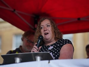 Woman speaking into microphone