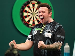 Callan Rydz celebrates after winning his third round match against Dimitri Van den Bergh at the 2025 World Championship