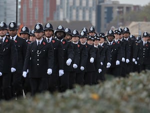 A line of Metropolitan Police recruits marching during a passing out parade