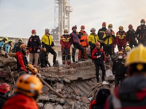 Rescuers at the site of a collapsed building in Turkey