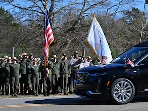 NPS employees salute the hearse