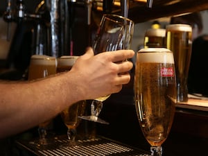 Beer being poured in a pub