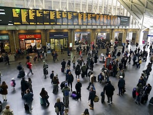 People on a railway station concourse