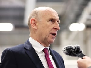 John Healey speaking to the media