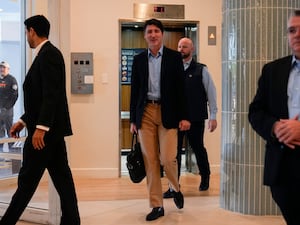 Trudeau walking through a hotel lobby