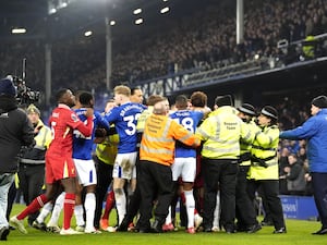 Liverpool and Everton players clash after the final whistle