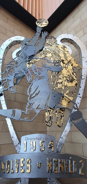 The statue uses silver leaf and gold to create a striking look