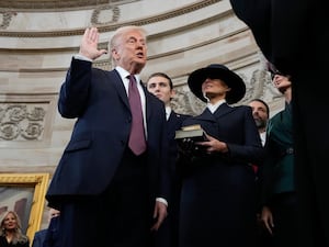 Donald Trump is sworn in as the 47th president of the United States by Chief Justice John Roberts as Melania Trump holds the Bible during the 60th Presidential Inauguration in the Rotunda of the US Capitol in Washington