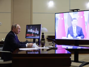 Russian President Vladimir Putin speaks with Chinese President Xi Jinping via videoconference