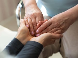 Hands of a mature woman or caregiver of care and support. Close-up.