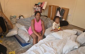 Reania says she has been sleeping on a mattress on her living room floor since November 