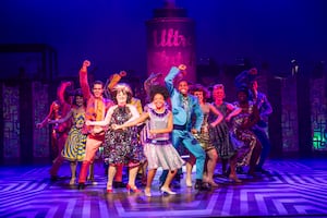 The cast of Hairspray on stage in Manchester.