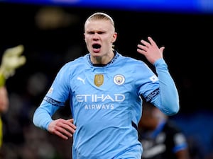 Manchester City's Erling Haaland tries to rally the crowd during a match