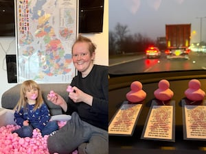 Woman and girl next to rubber ducks