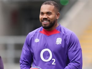 Ollie Lawrence laughs during an England training session