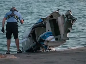 An image from a video provided by Australian Broadcasting Corporation, shows part of a plane wreckage being pulled onto shore on Rottnest Island