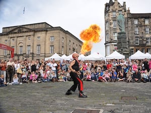 A street performer breathing fire in Edinburgh