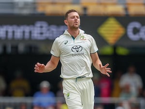 Josh Hazlewood reacts after bowling a ball