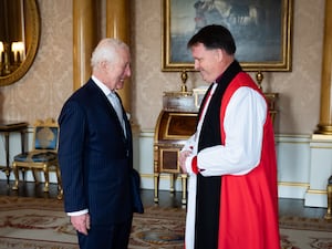 The King with Right Reverend Graham Usher, Bishop of Norwich, at Buckingham Palace