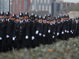 Police officers marching in a line