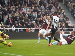 Alexander Isak (second right) scores for Newcastle