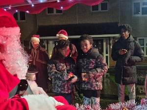 Children lined up to get a little gift from Santa and tell him what they were hoping to get for Christmas this year. 