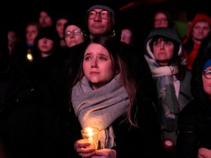 People outside Magdeburg Cathedral follow a memorial service for victims of Friday’s Christmas Market attack