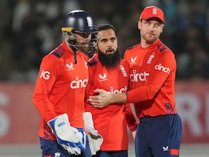 Phil Salt, Adil Rashid and Jos Buttler during England's third T20 against India in Rajkot