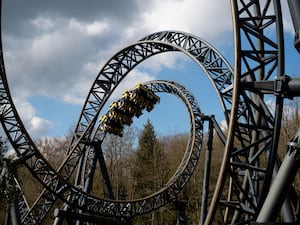 People enjoy a rollercoaster ride at Alton Towers in Staffordshire