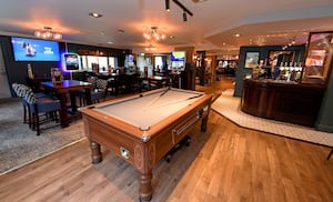 The pub has different areas for customers to enjoy a drink, a game of pool or a football match