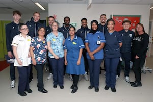 Players from West Bromwich Albion with staff on the children's ward at the Midland Met